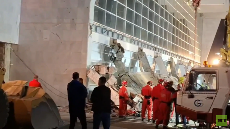 Rescue service workers inspect a scene as a roof collapsed at a railway station in Novi Sad, Serbia. © RT