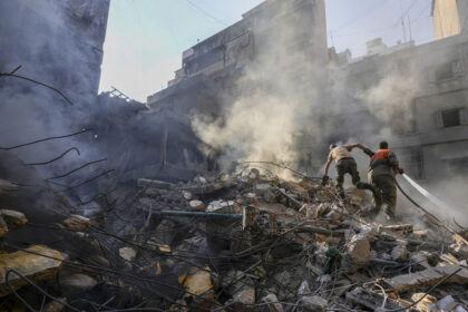 FILE PHOTO. Rescue workers search for victims at the site of Thursday's Israeli airstrike in Beirut, Lebanon. © AP Photo/Hassan Ammar