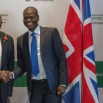 David Lammy and Ronald Lamola shake hands before the start of their meeting in Cape Town, South Africa.