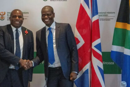 David Lammy and Ronald Lamola shake hands before the start of their meeting in Cape Town, South Africa.