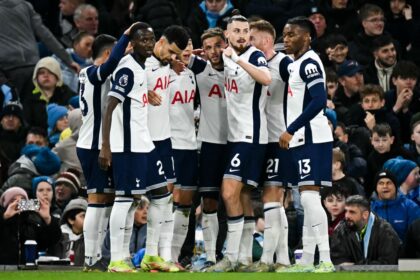 Tottenham Hotspur’s English midfielder #10 James Maddison (C) celebrates with teammates after scoring his team second goal during the English Premier League football match between Manchester City and Tottenham Hotspur at the Etihad Stadium in Manchester, north west England, on November 23, 2024. (Photo by Paul ELLIS / AFP)