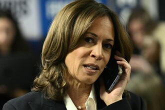 US Vice President and Democratic presidential candidate Kamala Harris takes part in a phone bank at the Democratic National Committee headquarters in Washington, DC, on November 5, 2024 (Photo by Brendan SMIALOWSKI / AFP)