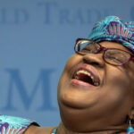 World Trade Organization (WTO) Director-General Ngozi Okonjo-Iweala reacts during a “Making trade score for women!” discussion on football as a tool for trade and development at the WTO headquarters in Geneva, on May 1, 2023. (Photo by Fabrice COFFRINI / AFP)