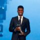 Brazilian forward Vinicius Junior poses with the Best Player trophy during the Best FIFA Football Awards 2024 ceremony in Doha on December 17, 2024. (Photo by Karim JAAFAR / AFP)