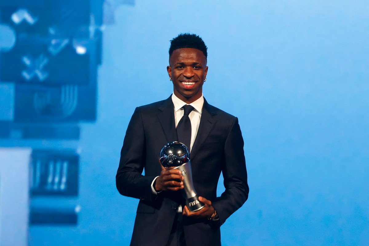 Brazilian forward Vinicius Junior poses with the Best Player trophy during the Best FIFA Football Awards 2024 ceremony in Doha on December 17, 2024. (Photo by Karim JAAFAR / AFP)