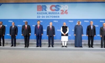 FILE: Ethiopia’s Prime Minister Abiy Ahmed, Egypt’s President Abdel Fattah al-Sisi, South Africa’s President Cyril Ramaphosa, China’s President Xi Jinping, Russia’s President Vladimir Putin, India’s Prime Minister Narendra Modi, UAE President Sheikh Mohammed bin Zayed al-Nahyan, Iran’s President Masoud Pezeshkian, and Brazil’s Foreign Minister Mauro Vieira posing for a family photo during the BRICS summit in Kazan on October 23, 2024. (Photo by Abdulla AL-NEYADI / UAE PRESIDENTIAL COURT / AFP)