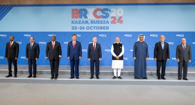 FILE: Ethiopia’s Prime Minister Abiy Ahmed, Egypt’s President Abdel Fattah al-Sisi, South Africa’s President Cyril Ramaphosa, China’s President Xi Jinping, Russia’s President Vladimir Putin, India’s Prime Minister Narendra Modi, UAE President Sheikh Mohammed bin Zayed al-Nahyan, Iran’s President Masoud Pezeshkian, and Brazil’s Foreign Minister Mauro Vieira posing for a family photo during the BRICS summit in Kazan on October 23, 2024. (Photo by Abdulla AL-NEYADI / UAE PRESIDENTIAL COURT / AFP)