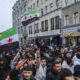 Expatriate Syrians gather with flags to celebrate the fall of the Assad regime in Syria on December 8, 2024 in Berlin, Germany. © Omer Messinger / Getty Images