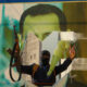 Jihadist militant tearing down a poster of Syrian Presdient Bashar Assad in Aleppo, Syria, November 30, 2024. © Getty Images / Rami Alsayed/NurPhoto