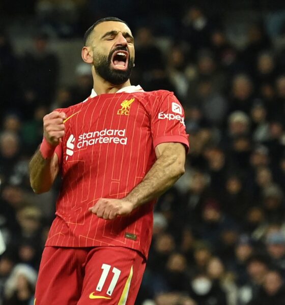 Liverpool’s Egyptian striker #11 Mohamed Salah celebrates after scoring their fourth goal during the English Premier League football match between Tottenham Hotspur and Liverpool at the Tottenham Hotspur Stadium in London, on December 22, 2024. (Photo by Glyn KIRK / AFP) /