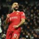 Liverpool’s Egyptian striker #11 Mohamed Salah celebrates after scoring their fourth goal during the English Premier League football match between Tottenham Hotspur and Liverpool at the Tottenham Hotspur Stadium in London, on December 22, 2024. (Photo by Glyn KIRK / AFP) /