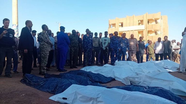 People gather around bodies of victims killed in a paramilitary forces attack in Omdurman city, Sudan, on Dec. 10, 2024. © Global Look Press/Khartoum State Government's Pre