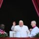 Pope Francis waves from the main balcony of St. Peter’s basilica after the Urbi et Orbi message and blessing to the city and the world as part of Christmas celebrations, at St Peter’s square in the Vatican on December 25, 2024. (Photo by Alberto PIZZOLI / AFP)