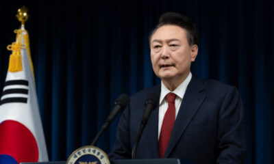 This handout photo taken and released on December 7, 2024 by the South Korean Presidential Office shows South Korea’s President Yoon Suk Yeol delivering an address at the Presidential Office in Seoul. (Photo by Handout / South Korean Presidential Office / AFP)