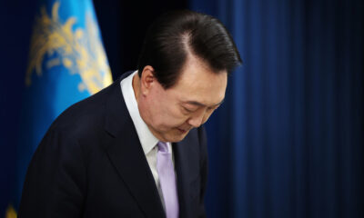 FILE PHOTO: South Korean President Yoon Suk-yeol bows during a press-conference. © Getty Images / Kim Hong-ji