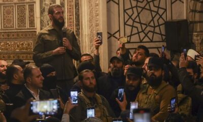 FILE PHOTO: The leader of Hayat Tahrir al-Sham (HTS), Ahmed Hussein al-Sharaa, better known by his nom de guerre Abu Mohammad al-Julani, speaks at the Umayyad Mosque in Damascus on December 8, 2024 © AP / Omar Albam