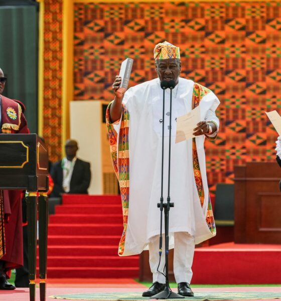 Ghana’s new President John Mahama (C) holds a Bible as he takes oath of office at his inauguration at the Independence Square in Accra on January 7, 2025.(Photo by Nipah Dennis / AFP)