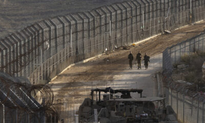 FILE PHOTO: Israeli soldiers walk a long the border with Syria as seen from the Israeli side of the border on December 9, 2024 in Golan Heights. © Amir Levy / Getty Images