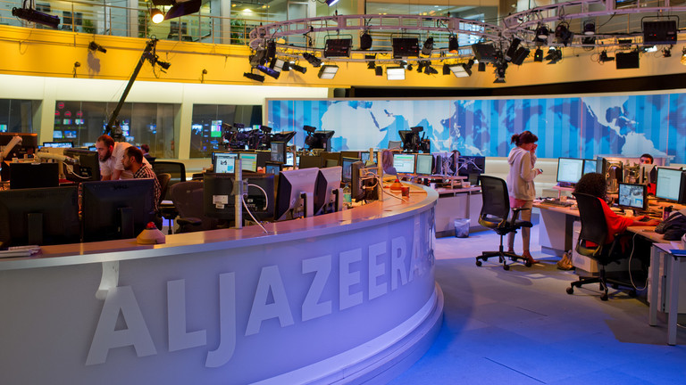 FILE PHOTO: Journalists work in the newsroom of the Arabic news broadcaster Al Jazeera. © Global Look Press / Tim Brakemeier