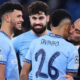 Manchester City manager Pep Guardiola plants a kiss on Savinho after his goal helped them into the Champions League play-offs with victory over Club Brugge