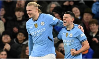 Manchester City’s English midfielder #47 Phil Foden (R) celebrates scoring the team’s third goal with Manchester City’s Norwegian striker #09 Erling Haaland during the English Premier League football match between Manchester City and Chelsea at the Etihad Stadium in Manchester, north west England, on January 25, 2025. Manchester City won the match 3-1. (Photo by Oli SCARFF / AFP)