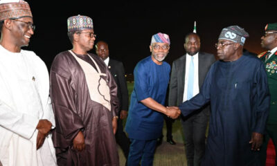 President Bola Tinubu shakes his Chief of Staff, Femi Gbajabiamila, and other top government officials upon his arrival to Abuja from Tanzania on January 28, 2025.