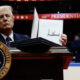 US President Donald Trump holds up a freshly signed executive order, Washington, DC, US, January 20, 2025. © Getty Images / Anna Moneymaker