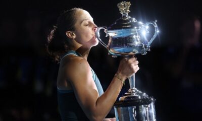 USA’s Madison Keys celebrates with the Daphne Akhurst Memorial Cup after victory against Belarus’ Aryna Sabalenka during their women’s singles final match on day fourteen of the Australian Open tennis tournament in Melbourne on January 25, 2025. (Photo by DAVID GRAY / AFP)