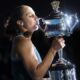 USA’s Madison Keys celebrates with the Daphne Akhurst Memorial Cup after victory against Belarus’ Aryna Sabalenka during their women’s singles final match on day fourteen of the Australian Open tennis tournament in Melbourne on January 25, 2025. (Photo by DAVID GRAY / AFP)