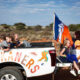 An Afrikaner cheerleading group looks at onlookers during a parade @ Per-Anders Pettersson/Getty Images