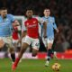 Arsenal’s English midfielder #49 Myles Lewis-Skelly (C) runs with the ball during the English Premier League football match between Arsenal and Manchester City at the Emirates Stadium in London on February 2, 2025. (Photo by Glyn KIRK / AFP) /