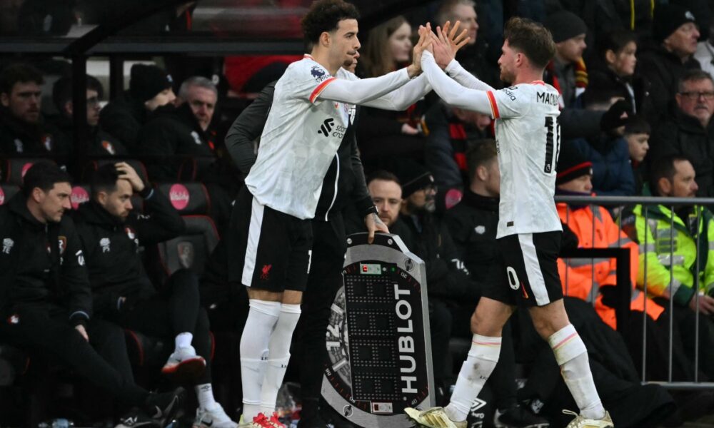 Liverpool’s English midfielder #17 Curtis Jones (L) comes on for Liverpool’s Argentinian midfielder #10 Alexis Mac Allister (R) during the English Premier League football match between Bournemouth and Liverpool at the Vitality Stadium in Bournemouth, southern England on February 1, 2025. (Photo by Glyn KIRK / AFP)