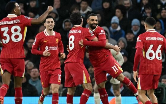 Liverpool’s Hungarian midfielder #08 Dominik Szoboszlai celebrates scoring the team’s second goal with Liverpool’s Egyptian striker #11 Mohamed Salah during the English Premier League football match between Manchester City and Liverpool at the Etihad Stadium in Manchester, north west England, on February 23, 2025. (Photo by Paul ELLIS / AFP)