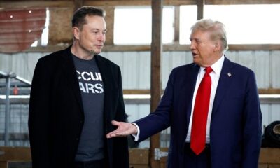 (FILES) Donald Trump offers his hand to Tesla and SpaceX CEO Elon Musk back stage during a campaign rally at the Butler Farm Show grounds on October 05, 2024 in Butler, Pennsylvania. (Photo by Anna Moneymaker / GETTY IMAGES NORTH AMERICA / AFP)