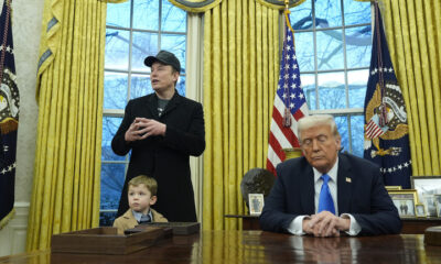 President Donald Trump listens as Elon Musk, joined by his son X Æ A-Xii, speaks at the White House, February 11, 2025 © AP / Alex Brandon