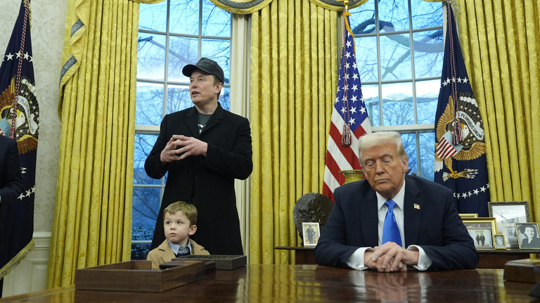 President Donald Trump listens as Elon Musk, joined by his son X Æ A-Xii, speaks at the White House, February 11, 2025 © AP / Alex Brandon