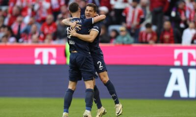 Bochum’s Costa Rican defender #02 Cristian Gamboa and Bochum’s Macedonian midfielder #17 Agon Elezi celebrate after the German first division Bundesliga football match between Bayern Munich and VfL Bochum in Munich, southern Germany, on March 8, 2025. (Photo by Alexandra BEIER / AFP)